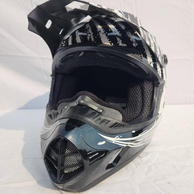 Sale Photo Thumbnail #46: 509 full-face off-road helmet featuring a bold black and white graphic design. Includes an adjustable visor, vented front for breathability, soft interior padding for comfort, and secure chin strap. Designed for off-road terrains and durable protection. S