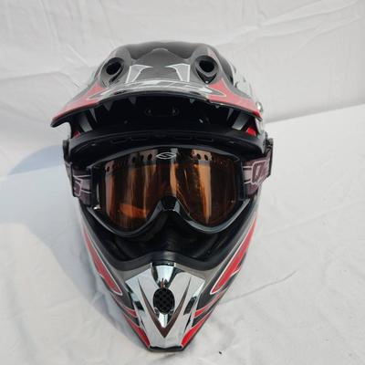 Sale Photo Thumbnail #49: HJC off-road motorcycle helmet featuring a striking red, black, and white graphic design. Includes an adjustable visor and built-in mounting points. Comes with tinted goggles for eye protection. Designed for off-road use, this helmet is lightweight and of