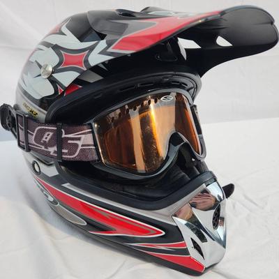 Sale Photo Thumbnail #52: HJC off-road motorcycle helmet featuring a striking red, black, and white graphic design. Includes an adjustable visor and built-in mounting points. Comes with tinted goggles for eye protection. Designed for off-road use, this helmet is lightweight and of