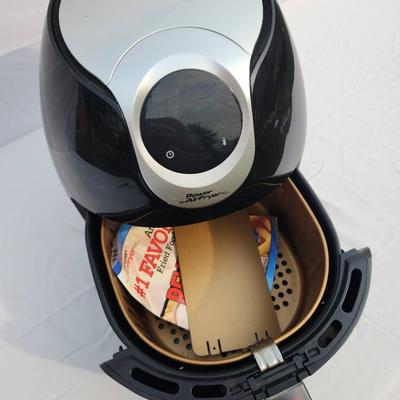Sale Photo Thumbnail #54: Power Air Fryer XL digital air fryer with a 5.3-quart capacity, designed for frying, baking, roasting, and reheating. Features a digital control panel with temperature and cooking presets. Comes in black finish with a silver accent panel. Includes basket 