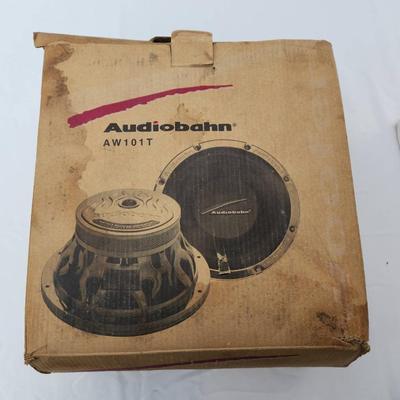 Sale Photo Thumbnail #58: Audiobahn AW101T 10-inch car subwoofer, featuring a dual 4-ohm voice coil configuration. The unit includes its original box with visible wear and signs of age. The subwoofer is housed in its protective packaging and exhibits a chrome design and branding o
