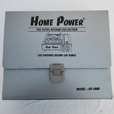 Sale Photo Thumbnail #60: Home Power HP-1000 portable butane gas range from the Total Kitchen Collection. Features a durable metal body with a gas burner and adjustable flame control dial. Includes a hard plastic carrying case for easy portability and storage. Designed for outdoor