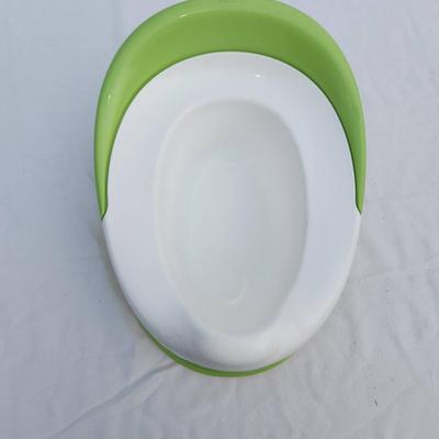 Sale Photo Thumbnail #67: BabyBjorn potty chair in green and white, made from durable, easy-to-clean plastic. Features a removable insert for easy cleaning and a non-slip base for stability. Includes a supportive backrest for added comfort. Designed for toddlers and small children