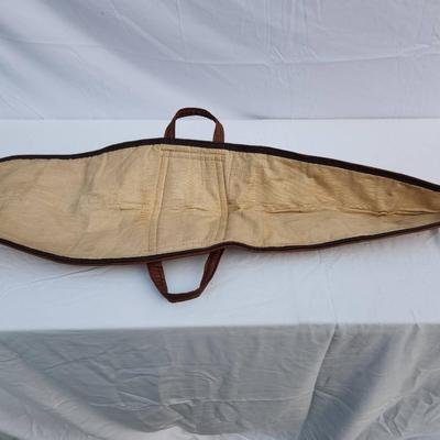 Sale Photo Thumbnail #70: J.M. Buchheimer gun case constructed with durable canvas material, leather trim, and reinforced leather handles. Features a soft interior lining to ensure firearm protection and a zippered closure. Branded with the J.M. Buchheimer tag featuring an America