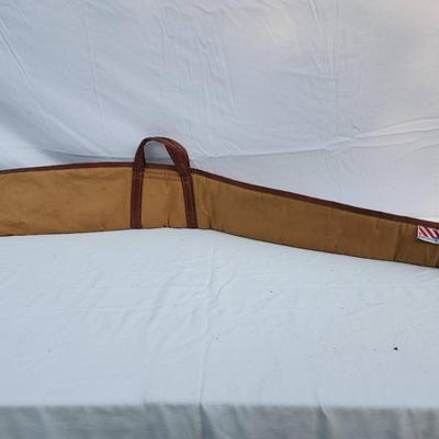 Sale Photo Thumbnail #69: J.M. Buchheimer gun case constructed with durable canvas material, leather trim, and reinforced leather handles. Features a soft interior lining to ensure firearm protection and a zippered closure. Branded with the J.M. Buchheimer tag featuring an America