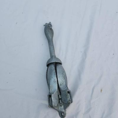 Sale Photo Thumbnail #88: Galvanized folding anchor featuring four flukes and a locking mechanism for secure use. Designed for small boats, kayaks, or as a portable anchoring solution. Folding design allows for compact storage. Constructed of durable galvanized metal to resist cor