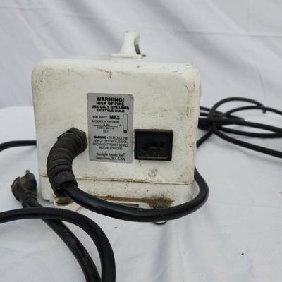 Sale Photo Thumbnail #105: Metal halide light fixture featuring a metal reflector housing, an integrated ballast unit, and a clear bulb installed. The ballast casing is white with visible signs of wear, and labeled with operational specifications. The unit includes wired connection
