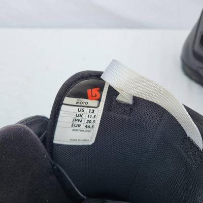 Sale Photo Thumbnail #108: Burton Moto snowboard boots in black, size US 13 (UK 11.5, EUR 46.5, JPN 30.5). Features include yellow pull-tab lacing system for easy tightening and adjustment. Designed for snowboarding activities. Pre-owned condition with visible wear, particularly on