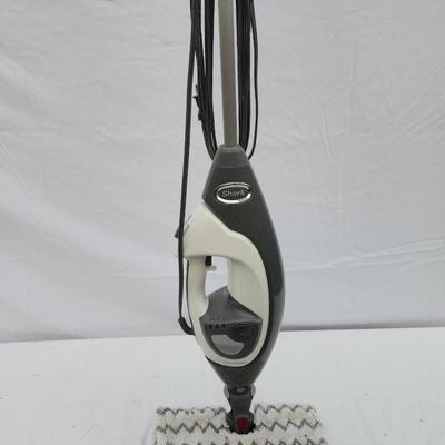 Sale Photo Thumbnail #121: Shark Professional steam mop with a gray and white body, featuring a steam control button for adjustable steam settings. Includes a detachable cleaning pad and cord for power. Designed for sanitizing and deep cleaning hard floors. Comes with an additional