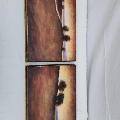 Sale Photo Thumbnail #150: Landscape paintings by artist Taino, depicting sunset scenes with trees in the foreground. Each painting is completed in warm, earthy tones and framed with simple gold-colored frames. Both are signed 'Taino' in the lower left-hand corner. The paintings ar