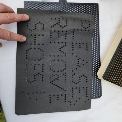 Sale Photo Thumbnail #169: Lite-Brite toy including the original box, perforated black panels, pegs in various colors, and a sample template sheet. The box shows signs of wear and age. The toy appears intact with its components. Power cord is visibly included. Condition of light fu