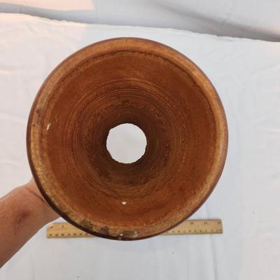Sale Photo Thumbnail #211: A handcrafted wooden goblet featuring a smooth wooden bowl and a beaded base adorned with decorative patterns. The intricate beadwork showcases figures and geometric designs, adding a striking detail. The goblet shows signs of prior use, with visible wear