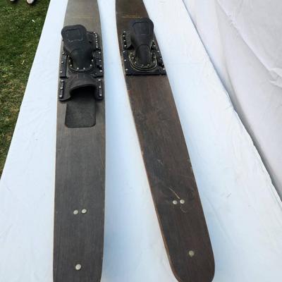 Sale Photo Thumbnail #256: Mach 1 Special wooden water skis featuring original rubber bindings labeled 'FORMULA S.' The skis exhibit a natural wood finish with 'Mach 1 Special' printed on the top. Suitable for water sports enthusiasts and collectors. Condition suggests prior use wi