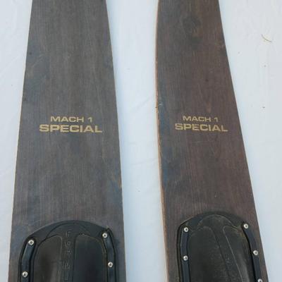 Sale Photo Thumbnail #255: Mach 1 Special wooden water skis featuring original rubber bindings labeled 'FORMULA S.' The skis exhibit a natural wood finish with 'Mach 1 Special' printed on the top. Suitable for water sports enthusiasts and collectors. Condition suggests prior use wi