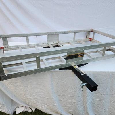 Sale Photo Thumbnail #267: Vevor hitch cargo carrier made from durable aluminum with a 60-inch platform. Designed for vehicles with a standard 2-inch receiver, this cargo carrier features a lightweight, corrosion-resistant frame with reflective elements for safety. Suitable for tra