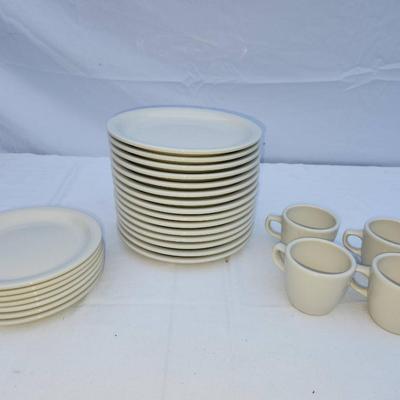 Sale Photo Thumbnail #275: 15 white ceramic restaurant-style dishes 7 saucers and 4 matching ceramic coffee cups. Dishes are rounded and stackable, designed for durability and frequent use. Coffee cups include handles for easy grip. All items are uniform in design, making them suit