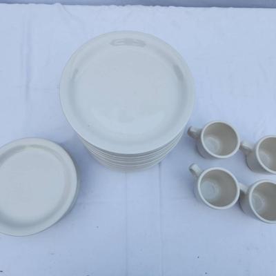 Sale Photo Thumbnail #276: 15 white ceramic restaurant-style dishes 7 saucers and 4 matching ceramic coffee cups. Dishes are rounded and stackable, designed for durability and frequent use. Coffee cups include handles for easy grip. All items are uniform in design, making them suit