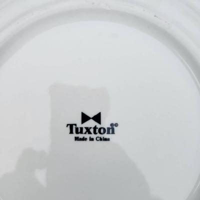 Sale Photo Thumbnail #285: 15 white ceramic restaurant-style plates, 7 matching saucers, and 4 handle-equipped coffee cups. All items are crafted for durability and are stackable, making them ideal for both commercial and home use. Uniform design ensures a cohesive look throughout 