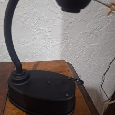 small desk globe that is suspended between magnets
