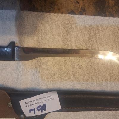Fixed blade knife with leather sheath