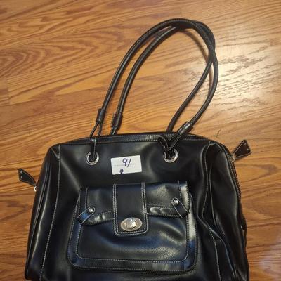 Black handbag or purse with shoulder strap