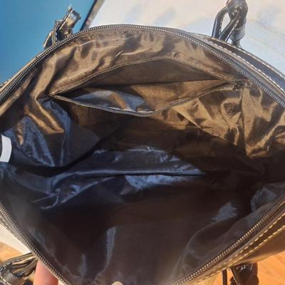 Black handbag or purse with shoulder strap