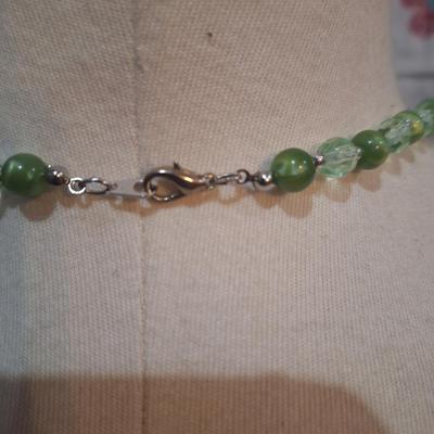 beaded necklace with greens, silver and clear beads