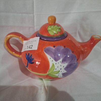 Teapot- reddish orange with floral design
