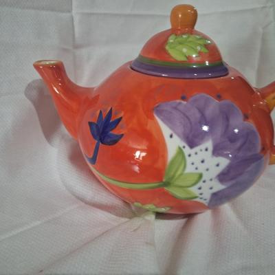 Teapot- reddish orange with floral design