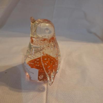 blown glass penguin with bubbles and orange center