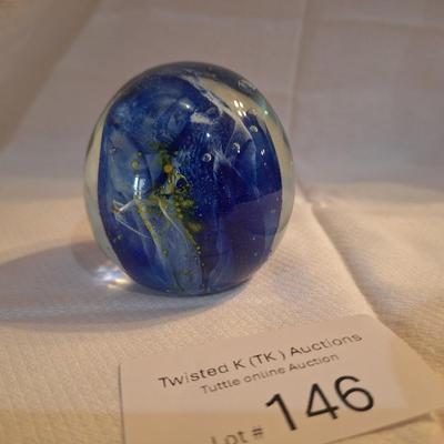 blown glass paperweight with blue swirls