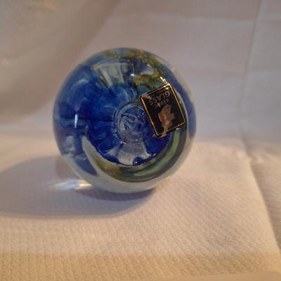 blown glass paperweight with blue swirls