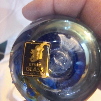 blown glass paperweight with blue swirls