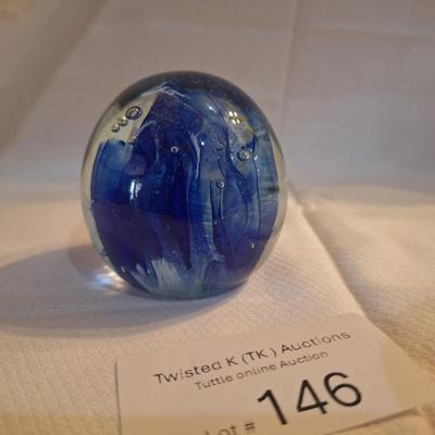 blown glass paperweight with blue swirls