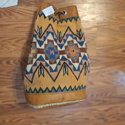 Bohemian style backpack handbag with leather and other material.