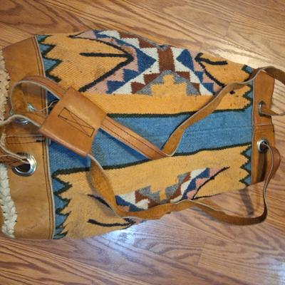 Bohemian style backpack handbag with leather and other material.
