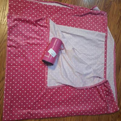 pink blanket and thermos