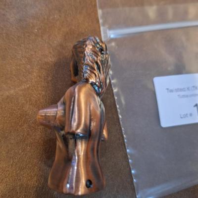 copper lighter of naked woman