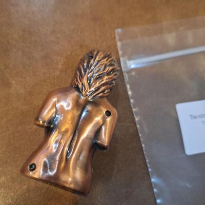 copper lighter of naked woman