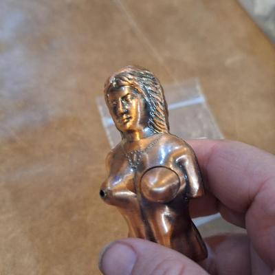 copper lighter of naked woman