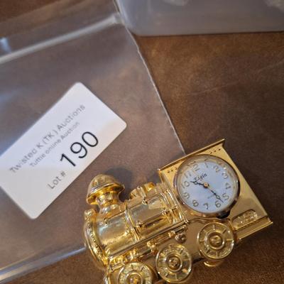 small golden tone Elgin clock shaped like train