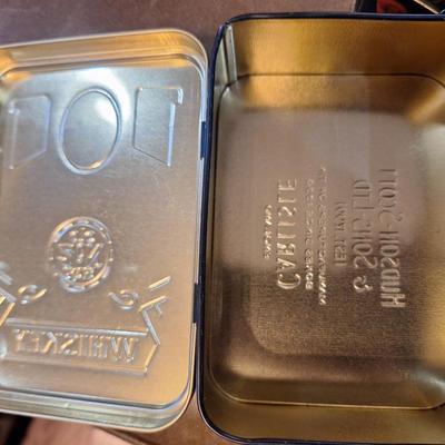 empty jack Daniels tins