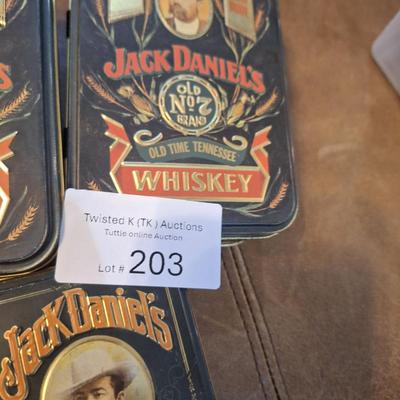 empty jack Daniels tins