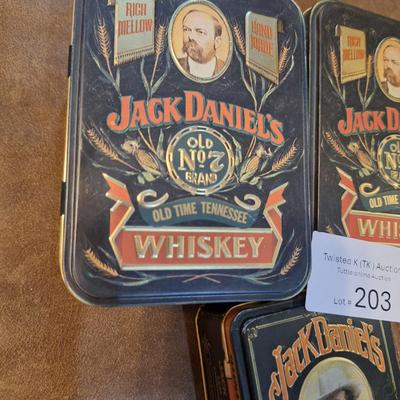 empty jack Daniels tins