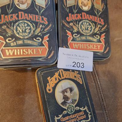 empty jack Daniels tins