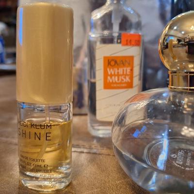 4 bottles of perfume, the coach perfume is approx. 1/4 full