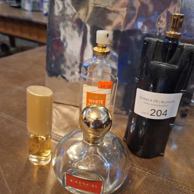 4 bottles of perfume, the coach perfume is approx. 1/4 full