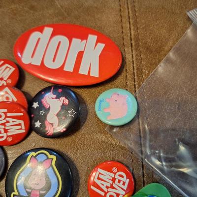 various buttons or pins