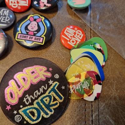 various buttons or pins