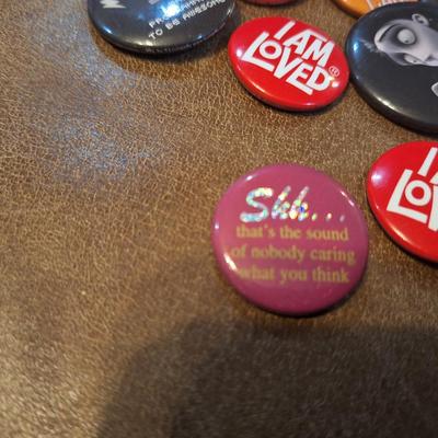 various buttons or pins